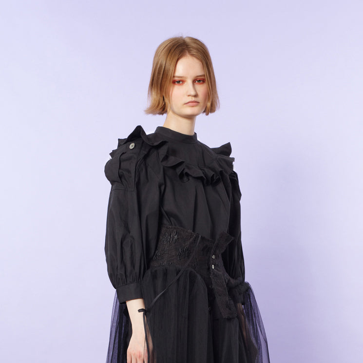 Blouse with ruffled flaps