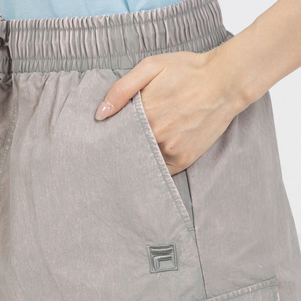 FILA CARGO SKIRT フィラ カーゴスカート CE6SCW007【レディース 製品染め サイドポケット ドローコード 26SS】