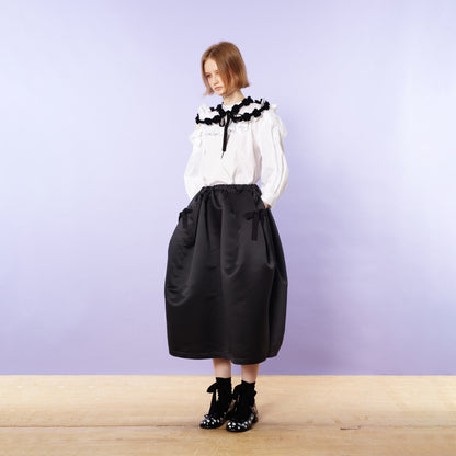 Blouse with ruffled flaps