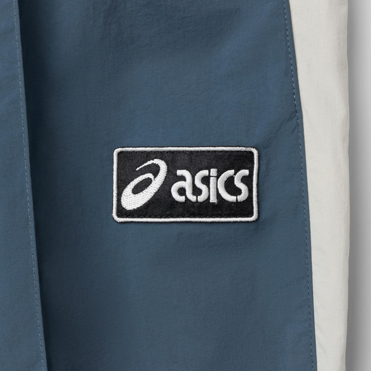 ASICS CLASSIC WOVEN TRACK PANT アシックス クラシック ウーブン トラックパンツ 2203A394【メンズ ナイロントラックパンツ ルーズフィット はっ水加工 ドローコード 26FW】